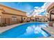 Community pool with seating area and beautiful sky view at 5370 S Desert Dawn Dr # 30, Gold Canyon, AZ 85118