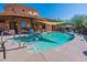 Relaxing community pool and spa area with shade canopy and lounge chairs at 5370 S Desert Dawn Dr # 30, Gold Canyon, AZ 85118