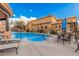 Community pool and hot tub with lounge chairs and seating area at 5370 S Desert Dawn Dr # 30, Gold Canyon, AZ 85118