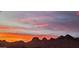 Colorful sunset against a mountain range at 5370 S Desert Dawn Dr # 30, Gold Canyon, AZ 85118