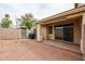 Private backyard featuring a covered patio, gravel, and block wall fencing at 5415 E Mckellips Rd # 104, Mesa, AZ 85215