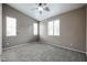 Cozy bedroom featuring a ceiling fan and two windows for natural light at 5415 E Mckellips Rd # 104, Mesa, AZ 85215