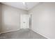 A carpeted bedroom with double doors leading to the hallway and a closet at 5415 E Mckellips Rd # 104, Mesa, AZ 85215