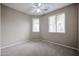 Neutral bedroom with carpet, a ceiling fan, and natural light from two windows at 5415 E Mckellips Rd # 104, Mesa, AZ 85215