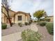 Charming single-Gathering home with desert landscaping, gravel, and a paved walkway to the front door at 5415 E Mckellips Rd # 104, Mesa, AZ 85215