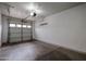 Clean, empty garage with open garage door at 5415 E Mckellips Rd # 104, Mesa, AZ 85215