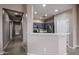 View of the kitchen with gray cabinets, stainless steel appliances, and white countertops at 5415 E Mckellips Rd # 104, Mesa, AZ 85215