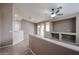 Bright and airy living room featuring a ceiling fan, a built-in niche, and sliding glass doors at 5415 E Mckellips Rd # 104, Mesa, AZ 85215