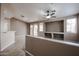 Bright and airy living room featuring a ceiling fan, a built-in niche, and sliding glass doors at 5415 E Mckellips Rd # 104, Mesa, AZ 85215