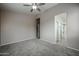 Spacious main bedroom with neutral walls, plush carpet, and an ensuite bathroom at 5415 E Mckellips Rd # 104, Mesa, AZ 85215