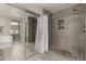 Bathroom showcasing a tiled walk-in shower, a soaking tub, and a mirrored closet at 6014 E Sayan Cir, Mesa, AZ 85215