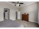 Comfortable main bedroom featuring a ceiling fan, carpet, and walk-in closet at 6014 E Sayan Cir, Mesa, AZ 85215