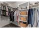 Walk-in closet offers ample storage with shelves and hanging rods for organization at 6014 E Sayan Cir, Mesa, AZ 85215