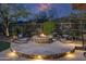 Beautiful outdoor fire pit with seating area and landscape lighting at 6888 E Mighty Saguaro Way, Scottsdale, AZ 85266