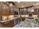 Modern kitchen with wood cabinets, stainless steel appliances, and granite counter tops at 6888 E Mighty Saguaro Way, Scottsdale, AZ 85266