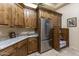 Well-equipped kitchen with custom wood cabinetry and stainless steel appliances at 6888 E Mighty Saguaro Way, Scottsdale, AZ 85266
