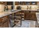 Custom kitchen featuring granite countertops, wood cabinets with pull-out organizers, and stainless steel appliances at 6888 E Mighty Saguaro Way, Scottsdale, AZ 85266