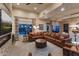 Spacious living room features a fireplace and a large, comfortable sectional sofa at 6888 E Mighty Saguaro Way, Scottsdale, AZ 85266