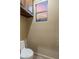 Powder room featuring a toilet and window with lovely view of the desert sunset at 6888 E Mighty Saguaro Way, Scottsdale, AZ 85266