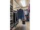 Walk-in closet with custom shelving and a variety of storage options at 6888 E Mighty Saguaro Way, Scottsdale, AZ 85266