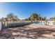 Spacious backyard with view of community golf course and blue pool surrounded by palm trees at 7416 S Mcallister Ave, Tempe, AZ 85283