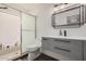 Modern bathroom featuring a sleek vanity, updated fixtures, and a glass-enclosed shower stall at 7416 S Mcallister Ave, Tempe, AZ 85283