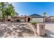 Charming single-story brick home with a two-car garage and a well-manicured front yard at 7416 S Mcallister Ave, Tempe, AZ 85283