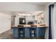 Modern kitchen featuring an island with seating and stainless steel appliances and butcherblock countertop at 7416 S Mcallister Ave, Tempe, AZ 85283