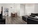 Open-concept living and dining area with wood floors and an abundance of natural light at 7416 S Mcallister Ave, Tempe, AZ 85283