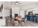 Inviting living room with fireplace, open floor plan, and views of the kitchen bar at 7416 S Mcallister Ave, Tempe, AZ 85283