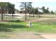 Scenic community pond surrounded by lush green spaces and mature trees offering a peaceful atmosphere at 7416 S Mcallister Ave, Tempe, AZ 85283