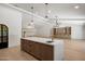 Spacious kitchen island, open floor plan with views into the living room at 7528 E Windrose Dr, Scottsdale, AZ 85260