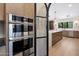 Kitchen featuring wood cabinets, stainless steel appliances, and an open-concept design at 7528 E Windrose Dr, Scottsdale, AZ 85260