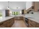Bright kitchen features wood cabinets, stainless steel appliances, and an eat-in island at 7528 E Windrose Dr, Scottsdale, AZ 85260