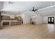Open concept living area with hardwood floors, kitchen island, and modern design at 7528 E Windrose Dr, Scottsdale, AZ 85260