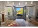 A welcoming entryway with double doors leading to a patio and backyard, creating a seamless indoor-outdoor flow at 8964 E Mountain Spring Rd, Scottsdale, AZ 85255