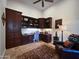 Dedicated home office space with built-in shelving and ample storage, providing a functional workspace at 8964 E Mountain Spring Rd, Scottsdale, AZ 85255