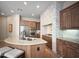 Spacious kitchen with stainless steel appliances, granite countertops, and a large island with seating at 8964 E Mountain Spring Rd, Scottsdale, AZ 85255