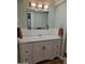 Bathroom featuring a vanity with white countertop and neutral wall color at 907 E Lancaster Cir, Florence, AZ 85132