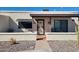 Charming single-story home with desert landscaping and a cozy covered front porch at 907 E Lancaster Cir, Florence, AZ 85132