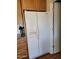 Kitchen featuring a large white refrigerator with water and ice dispenser at 907 E Lancaster Cir, Florence, AZ 85132