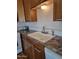 Kitchen with double basin sink, white subway tile backsplash, and wood cabinets at 907 E Lancaster Cir, Florence, AZ 85132