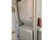 Stackable washer and dryer maximizing space in the laundry area at 907 E Lancaster Cir, Florence, AZ 85132