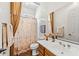 Well-lit bathroom featuring a shower, a vanity, and decorative accents at 9327 E Whitewing Dr, Scottsdale, AZ 85262