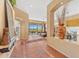 Spacious foyer with tile flooring leading to the living area, featuring a decorative niche and ample natural light at 9327 E Whitewing Dr, Scottsdale, AZ 85262