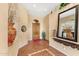 Welcoming entryway showcasing tile flooring, neutral walls, and decorative niches, providing a charming first impression at 9327 E Whitewing Dr, Scottsdale, AZ 85262