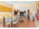 Bright kitchen and breakfast area with stainless appliances, island with seating, and view to the dining area at 9327 E Whitewing Dr, Scottsdale, AZ 85262