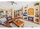 Stylish living area with fireplace, media center, and tile accents, designed for relaxation and entertainment at 9327 E Whitewing Dr, Scottsdale, AZ 85262