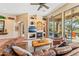 Comfortable living room with fireplace, built in shelves, and a large sliding door to the outdoor living space at 9327 E Whitewing Dr, Scottsdale, AZ 85262
