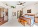Spacious main bedroom featuring neutral tones, a barn door to the ensuite, and an art niche at 9327 E Whitewing Dr, Scottsdale, AZ 85262
